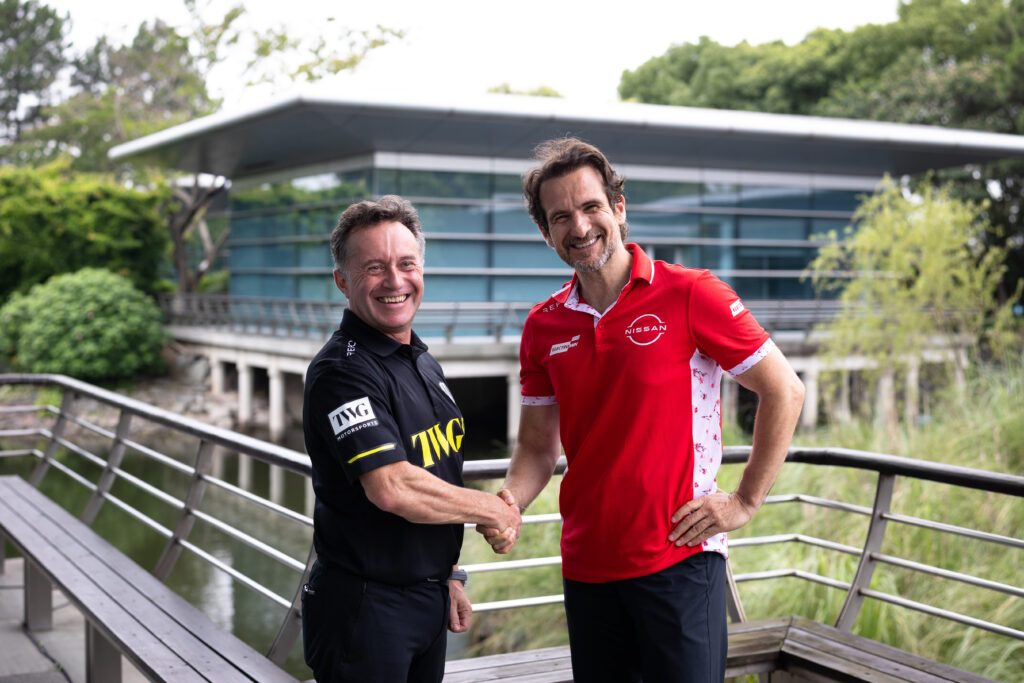 Landscape image of Tommaso Volpe, managing director and team principal, Nissan Formula E Team and Roger Griffiths, Team Principal, Andretti Formula E shaking hands and smiling.